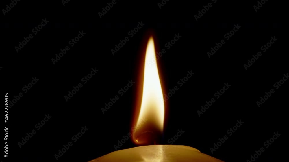 ultra Markro shot burning candle isolated on black background flame moving in wind shot in 4k super slow motion ultra Markro shot burning candle isolated on black background flame moving in wind shot in 4k super slow motion