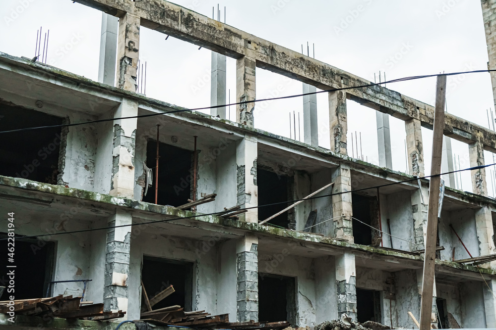 The ruins of an old panel building made of concrete blocks