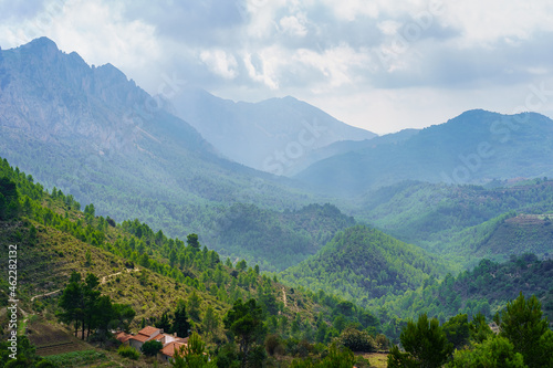 High mountains with mist and different layers that are lost in the horizon.