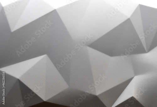 Monochrome background in style of futuristic minimalism. Geometric pattern of triangles and polygons. Shades of gray. Topic - minimalism