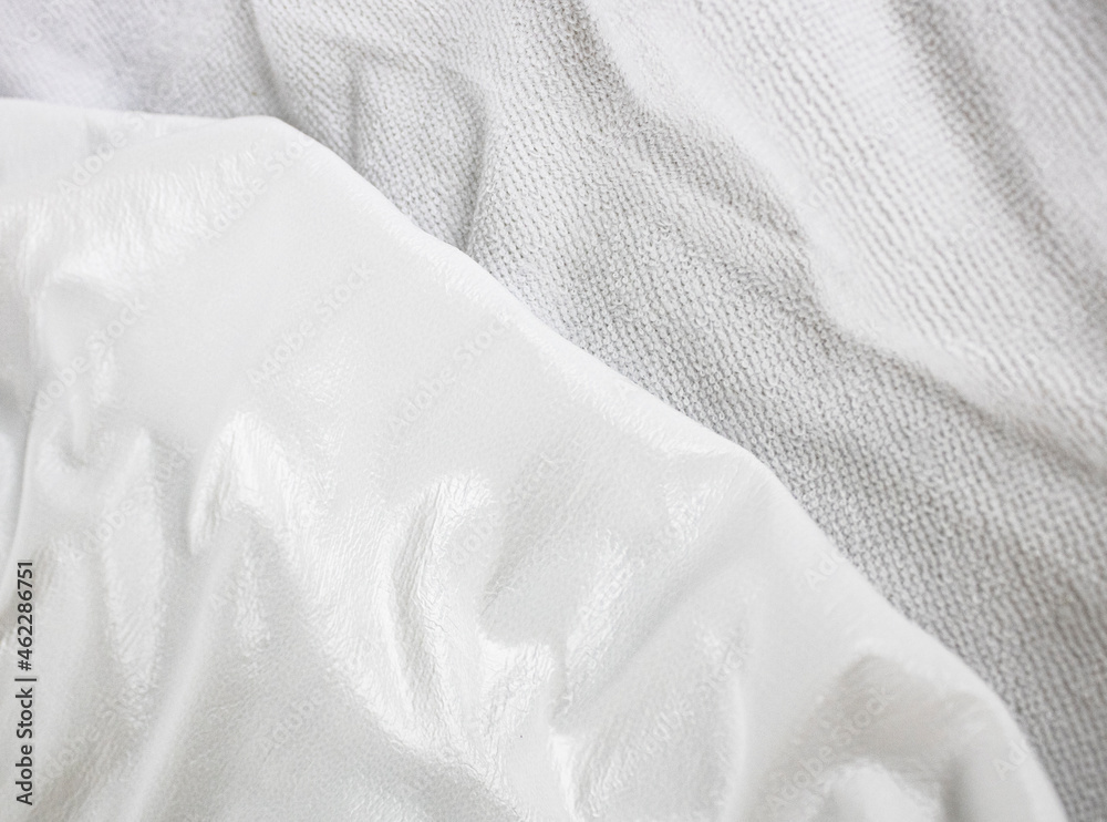 White texture close-up of material for making waterproof mattress covers. Protection of the bed from water and baby secretions. Production of mattress covers from cotton materials