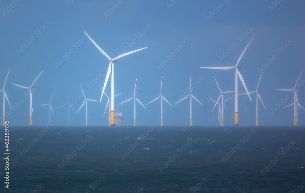 wind turbines in action at Gwynt y Môr (Sea wind) 576-megawatt offshore electricity generating wind farm with 160 x 150m high turbines in Colwyn Bay Wales