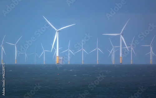 wind turbines in action at Gwynt y Môr (Sea wind) 576-megawatt offshore electricity generating wind farm with 160 x 150m high turbines in Colwyn Bay Wales