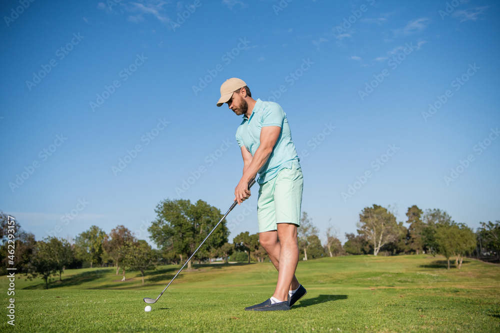 busy golfer in cap with golf club, golf course busy golfer in cap with golf club, golf course