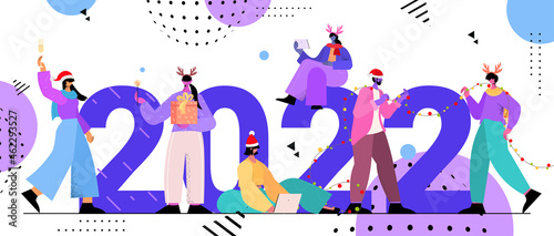 people in santa hats holding gifts mix race businesspeople celebrating 2022 new year and christmas holidays concept