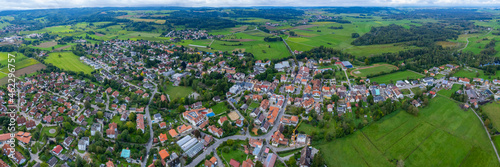 Aerial around the village Wilhelmsdorf in Germany on a cloudy day in summer