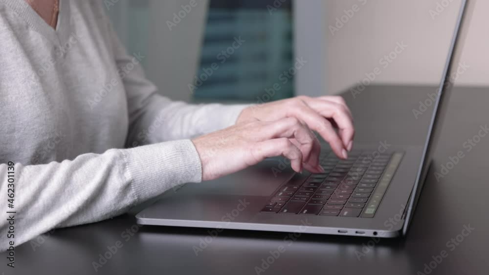 Hands of business woman typing on laptop keyboard. Female at home office desk Hands of business woman typing on laptop keyboard. Female at home office desk