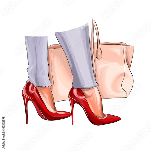 Beautiful female legs with a bag. Fashion woman legs in red shoes. Parts of the female body. Red high heels from multicolored paints