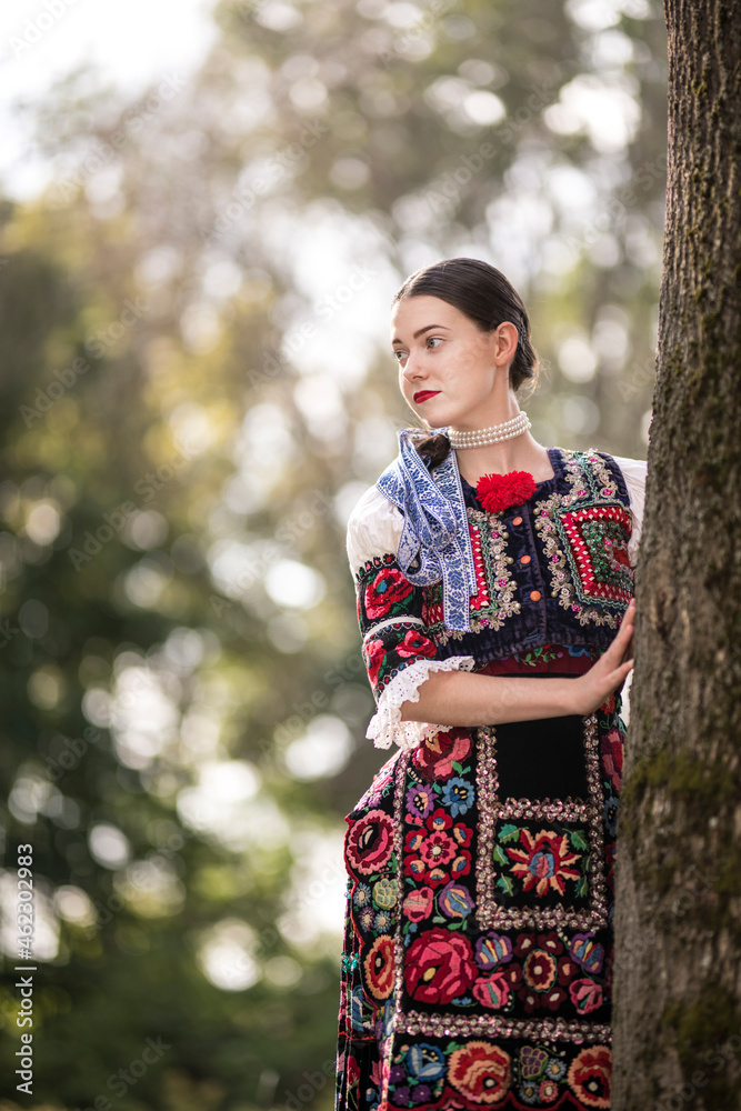 Young beautiful slovak woman in traditional dress. Slovak folklore Young beautiful slovak woman in traditional dress. Slovak folklore