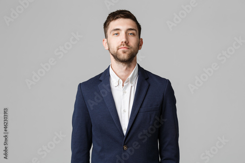 Business Concept - Young successful businessman posing over dark background. Isolated White Background. Copy space. photo