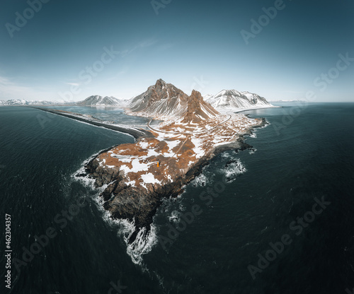 Drone view of a snow covered Eystrahorn mountain in Iceland at Hvalnes peninsula photo