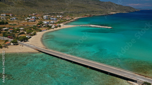 Aerial drone photo of main port of Kythera island and turquoise exotic beach of Diakofti, Ionian, Greece