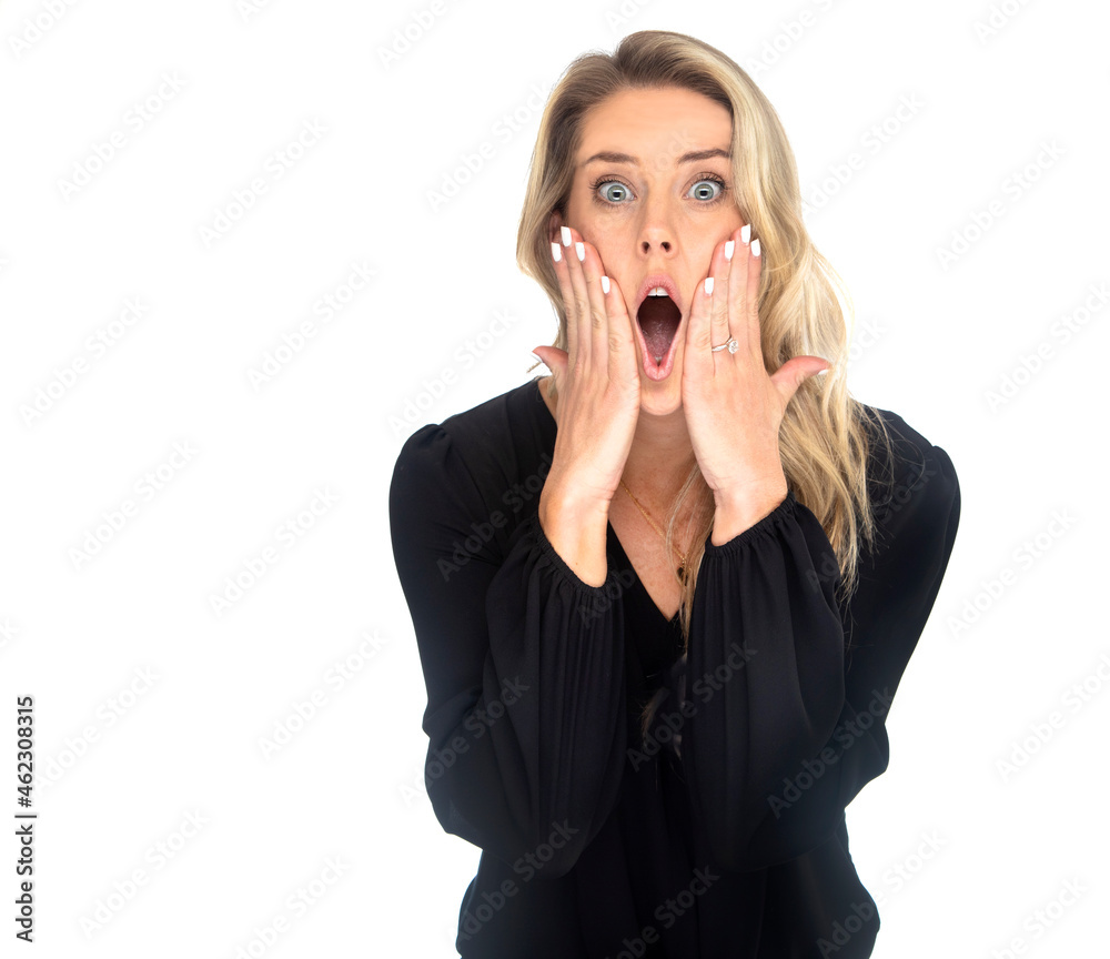 Attractive blonde with a suprised expression and both hands on her face photographed on a white background Attractive blonde with a suprised expression and both hands on her face photographed on a white background