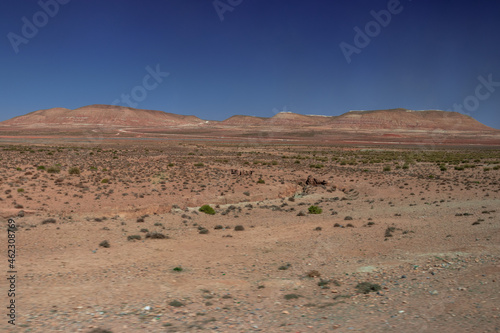 Africa Morocco desert Atlas mountains nature rock landscape with river palm under blue sky hot weather 