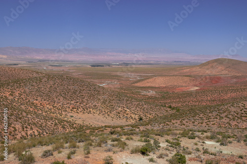 Africa Morocco desert Atlas mountains nature rock landscape with river palm under blue sky hot weather 
