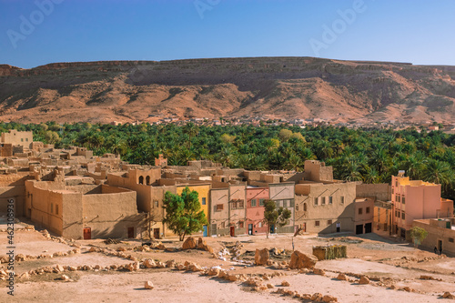 Africa Morocco desert Atlas mountains nature rock landscape with river palm under blue sky hot weather 