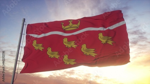 East Sussex flag, England, waving in the wind, sky and sun background. 3d rendering