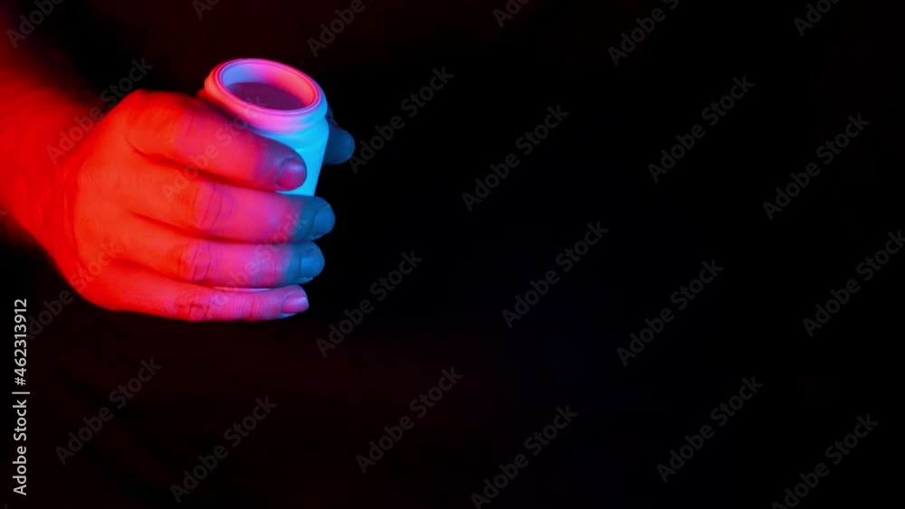 Man Pours Two Pills From The Pills Bottle In The Palm Of His Hand