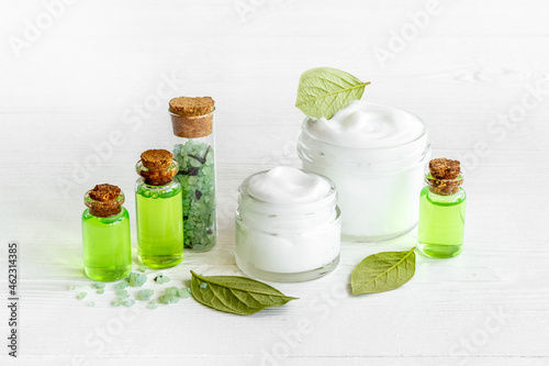 Cosmetic products with tea aroma oil and green leaves