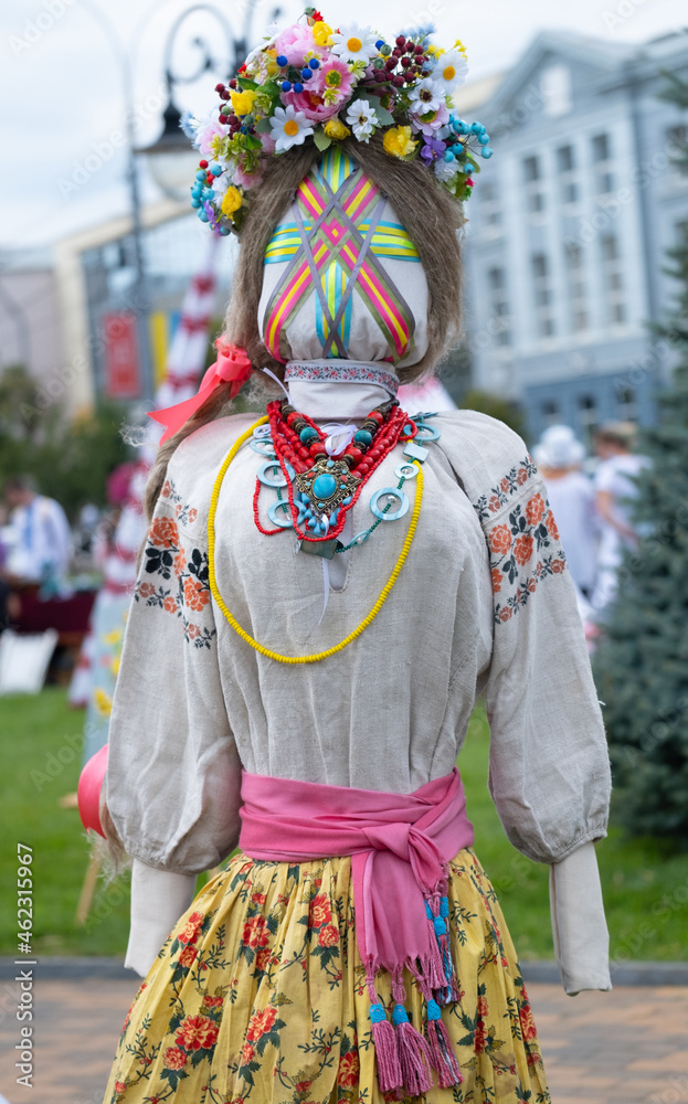 Handcraft dolls in national ukrainian clothes. Embroidered shirt on a mannequin. National dress