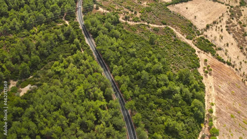 Flying over the highway. Cars drive on highway in countryside. Aerial view Flying over the highway. Cars drive on highway in countryside. Aerial view