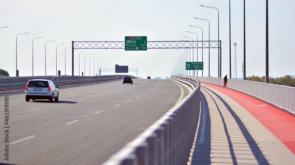 Bicycle path and sidewalk through the highway bridge. Bicycle path and sidewalk through the highway bridge.