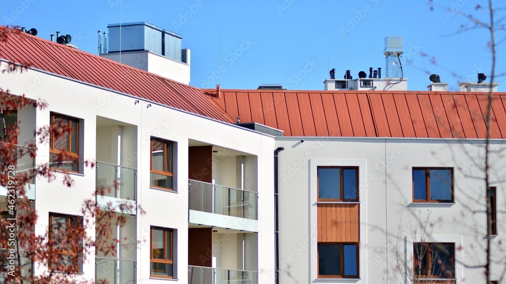 Fototapeta premium Modern and new apartment building. Multistoried modern, new and stylish living block of flats.