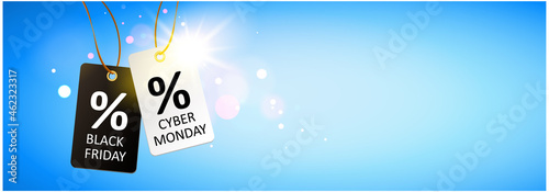 Black Friday & Cyber Monday. Black and white hanging  labels with sparkling light reflection and sky background 