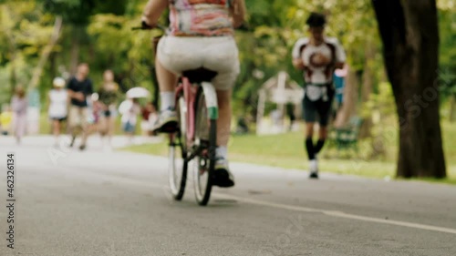 Wallpaper Mural Crowd of urban population enjoying early morning walk, exercising and riding bicycle early in park during the weekend break recreational activities Torontodigital.ca