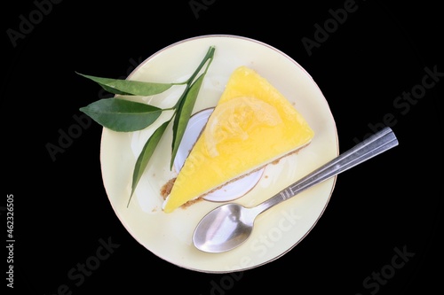 Cheese cake lemon isolated on black background