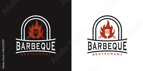 BBQ retro vintage design logo with spatula logo and fire concept in combination