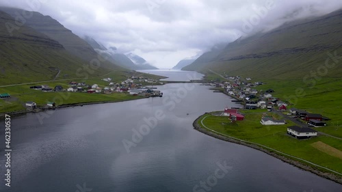 Beautiful aerial view of the City of Klaksvik in the Fareo Islands with its colorful houses and amazing canal and view to the majestic Kunoy Park