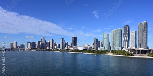 City of Miami, Florida skyline reflected in Biscayne Bay under sunny summer cloudscape. © Francisco