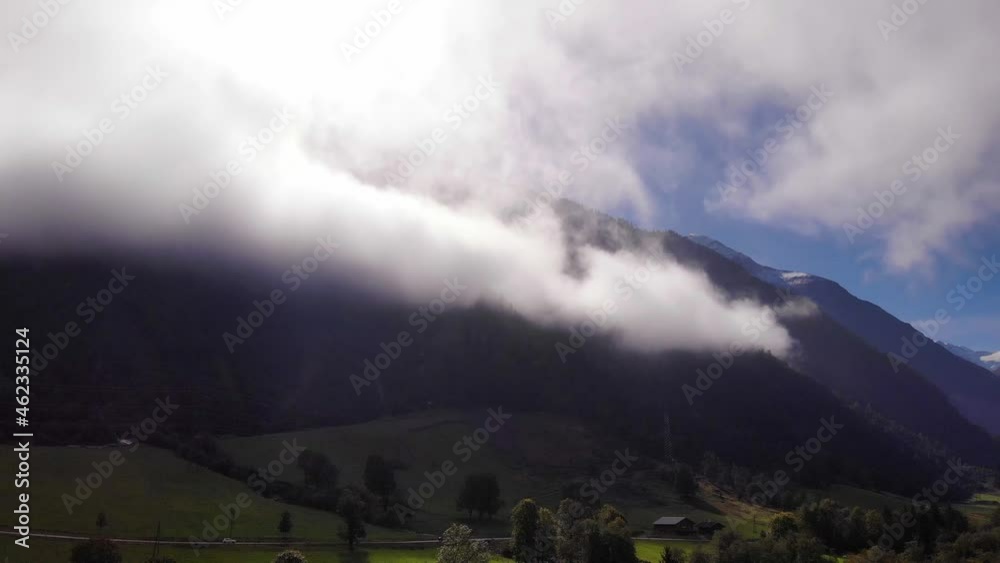 Clouds Canopy Austrian Alps On A Sunny Morning Near Klammsee Lake In Kaprun Austria. Static Clouds Canopy Austrian Alps On A Sunny Morning Near Klammsee Lake In Kaprun Austria. Static