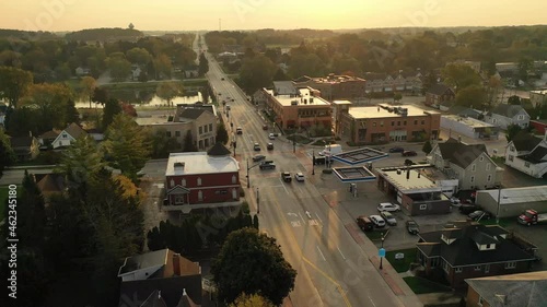 Sunny morning in a small quiet american town. Main street with shops, small business.  Establishing shot, aerial overhead view.  photo