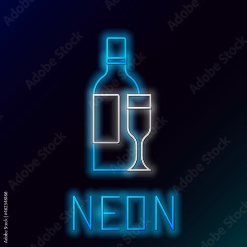 Glowing neon line Champagne bottle with glass icon isolated on black background. Colorful outline concept. Vector