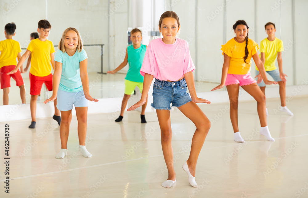 Happy kids having fun in a choreography studio during dance lesson