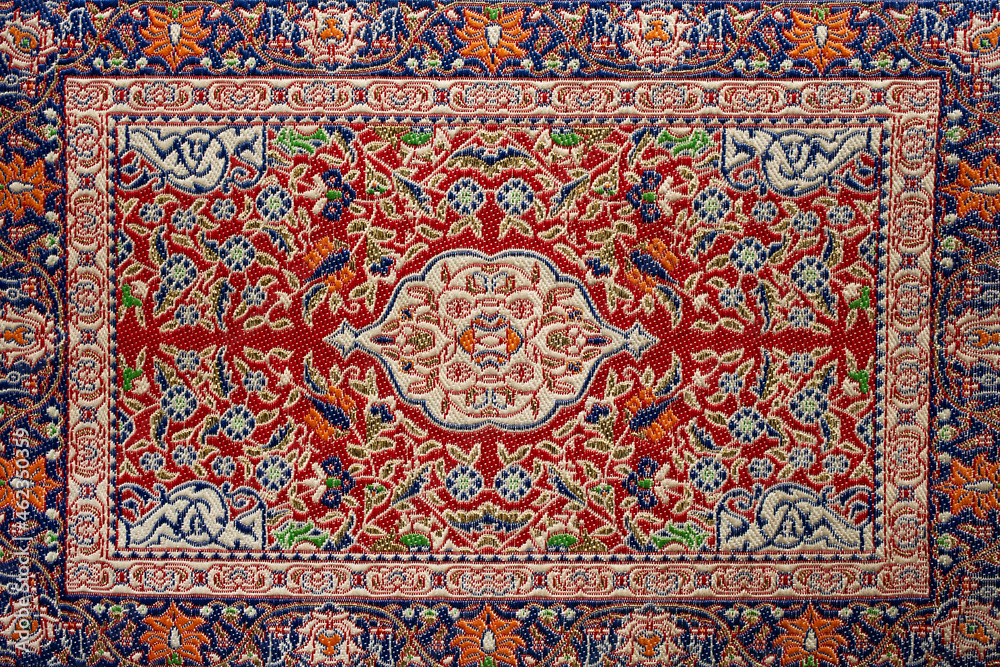 Vintage arabic carpet texture with ornament.