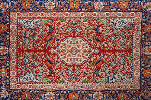 Vintage arabic carpet texture with ornament.