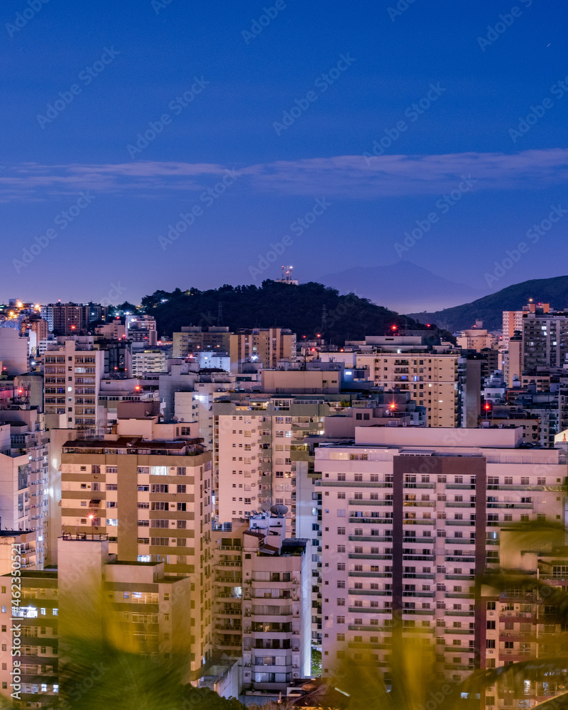 Naklejka premium Niterói, Rio de Janeiro, Brazil - CIRCA 2021: Long exposure urban night photography with buildings and lights of a Brazilian city