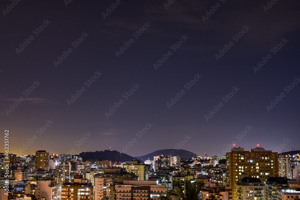Obraz premium Niterói, Rio de Janeiro, Brazil - CIRCA 2021: Long exposure urban night photography with buildings and lights of a Brazilian city