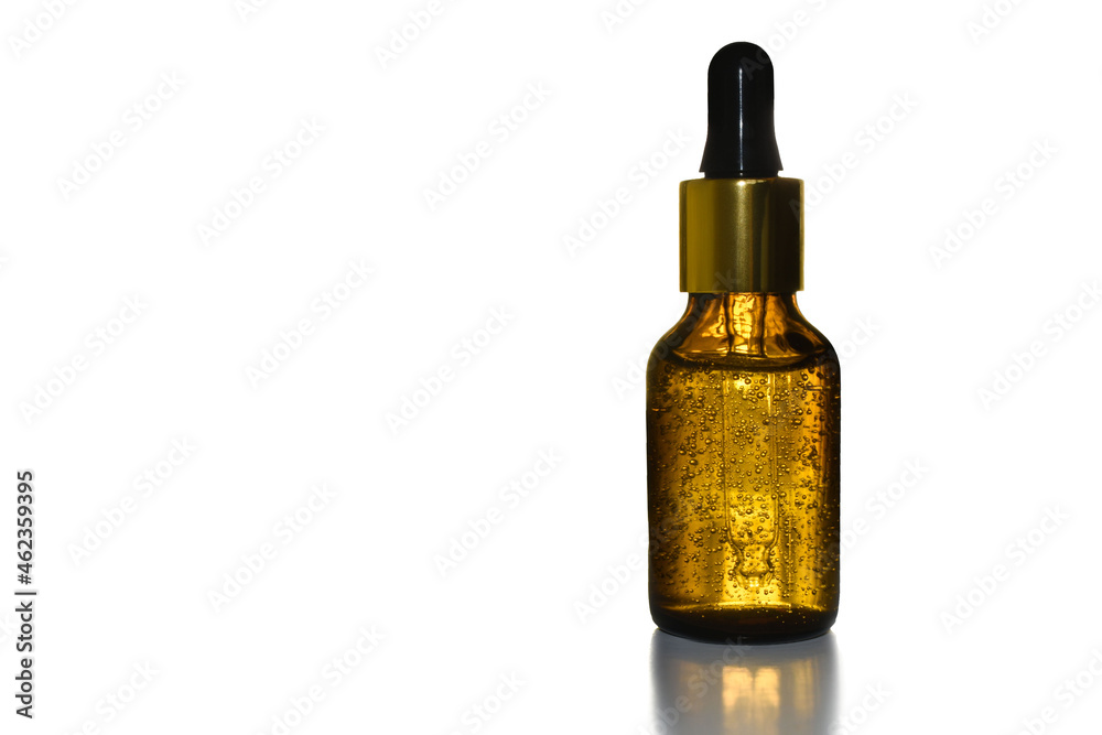 Cosmetical tools. liquid in a brown bottle with a pipette close-up. Brown bottle with bubbles. High quality photo. Isolated