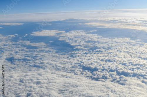 Clouds and sky as seen through window of an aircraft © byrdyak