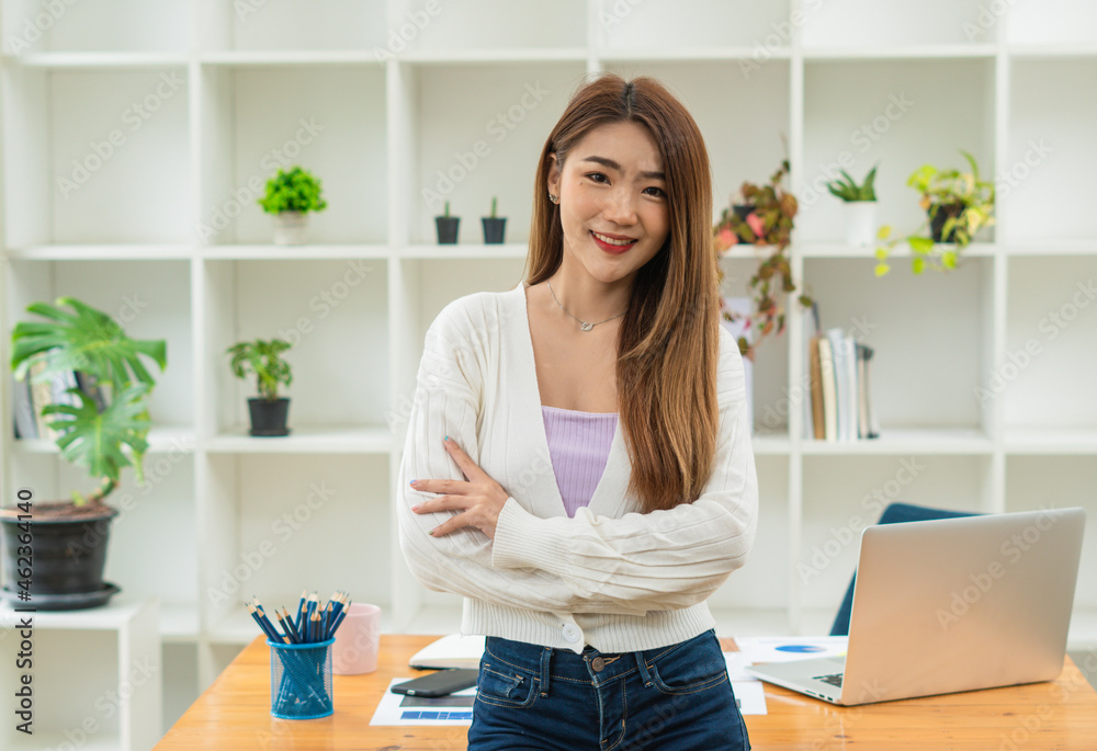 Portrait Of Attractive Asian Businesswoman Working On Laptop for marketing plan Portrait Of Attractive Asian Businesswoman Working On Laptop for marketing plan