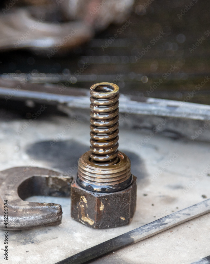Bolts from a truck under repair. Bolts from a truck under repair.