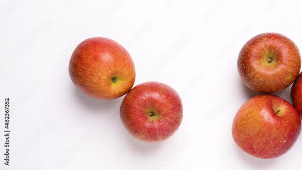 A red apple on a white background, photographed from directly above, dolly Video. A red apple on a white background, photographed from directly above, dolly Video.