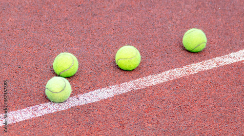 Tennis ball on the court. © schankz