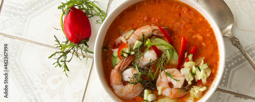 Obraz na płótnie bowl of gazpacho soup with shrimps on a light table