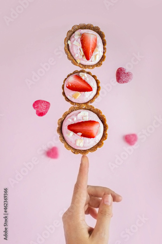 Steaming and balancing vegan cakes on your finger. magic and minimalism. healthy sweets.