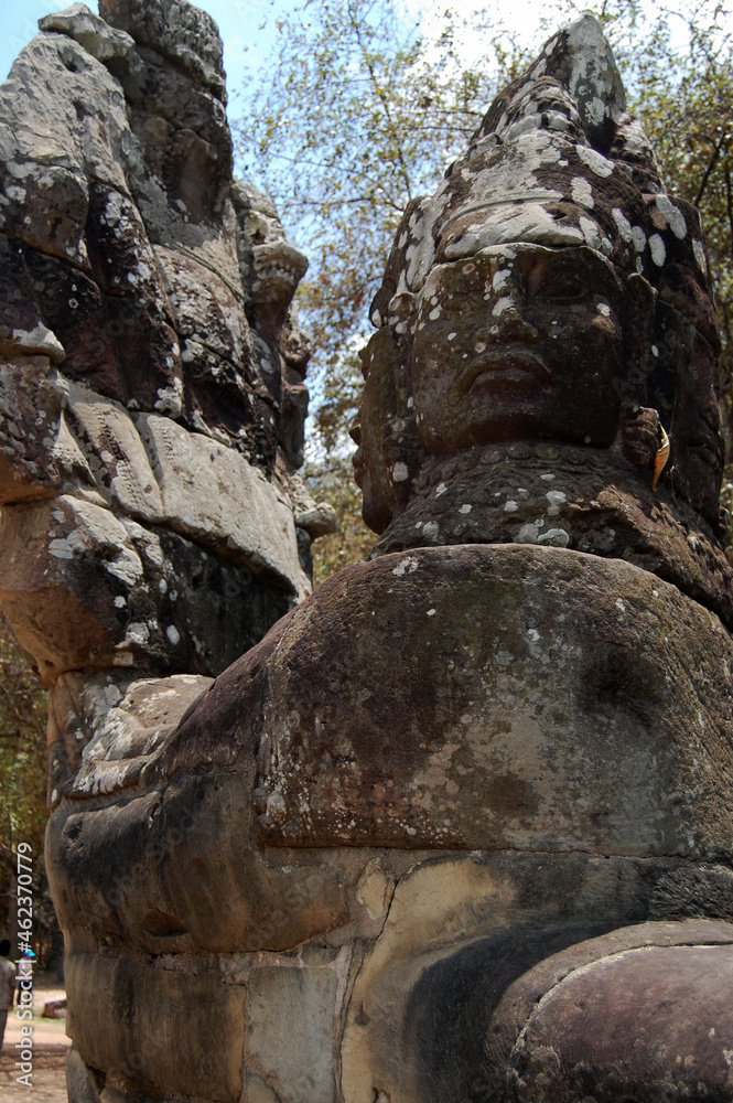 Sculpture carving figure deity angel spirit and Naga statue at entrance ancient ruins building Nokor Thom of South Gate bridge in Hindu and Buddhist cultural go to Angkor wat at Siem Reap, Cambodia